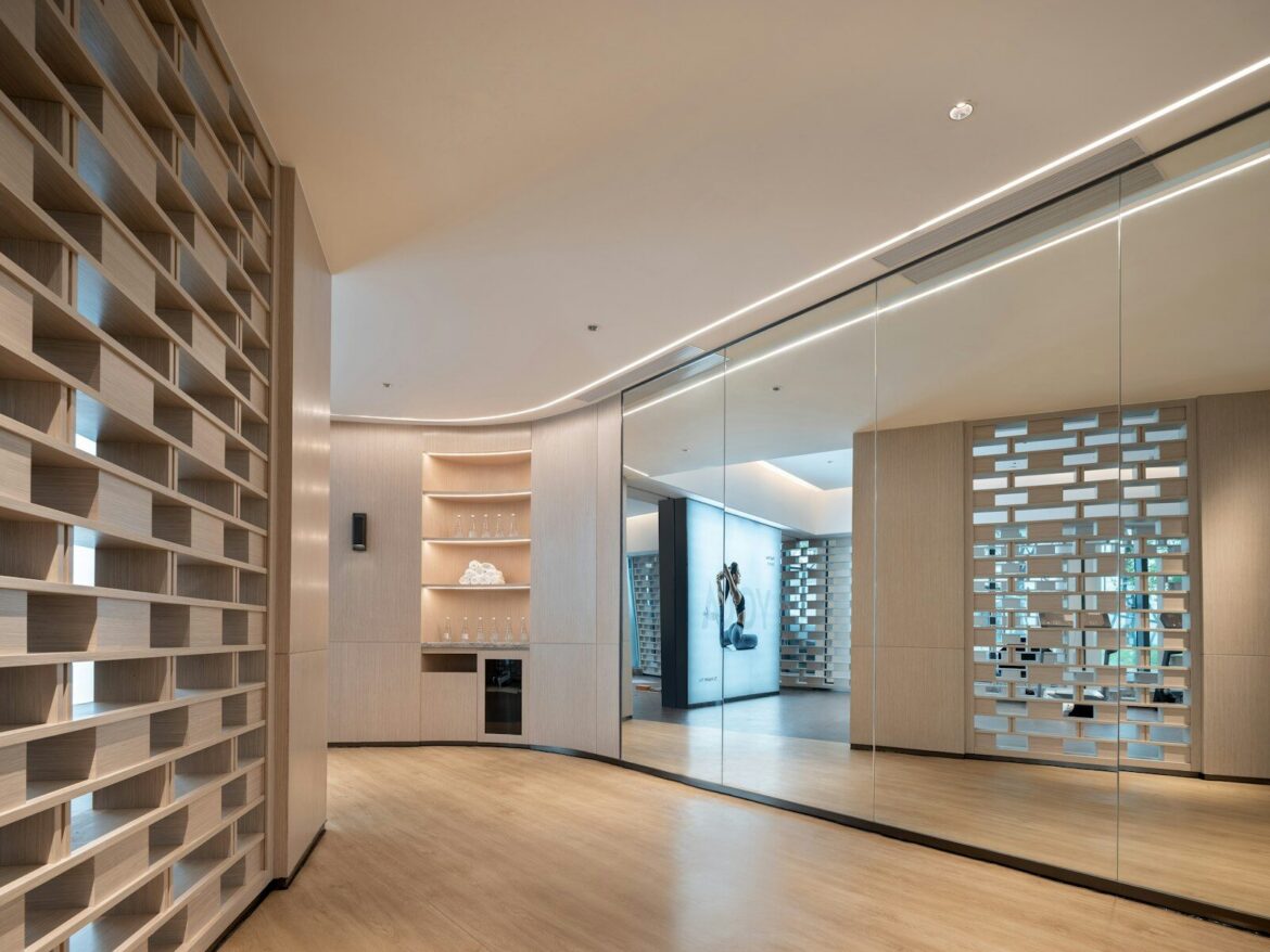 Modern interior hallway with decorative screen and shelving.